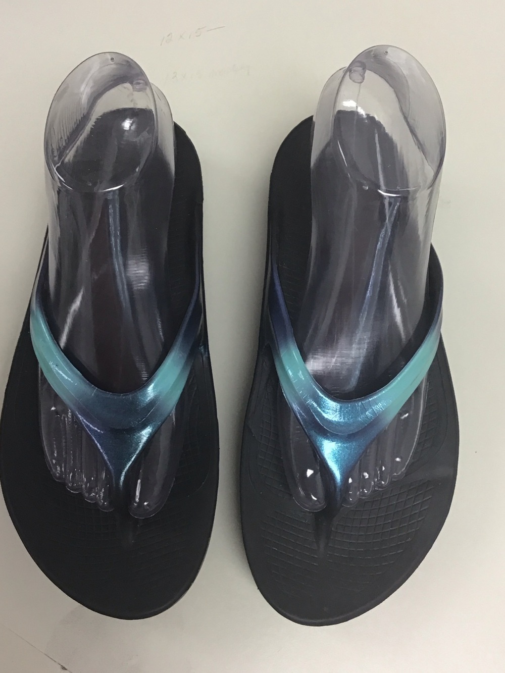 OOFOS Women's Black Flip Flop Sandals with Iridescent Blue-Green Straps